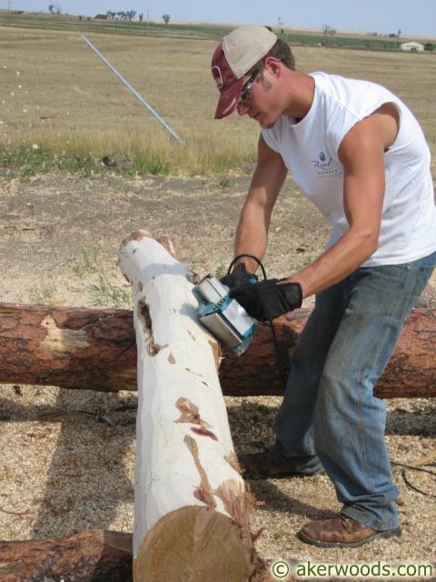 Peeling house logs 